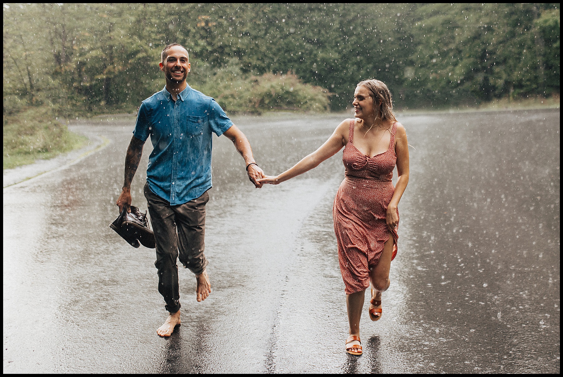 An engaged couple running through the rain at Buttermilk Falls in Ithaca, New York | Parr Photo Co | Colorado Wedding Photographer