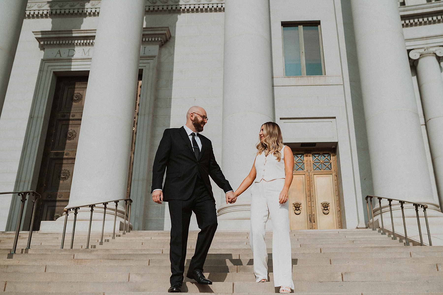 a couple doing denver engagement photos at the courthouse