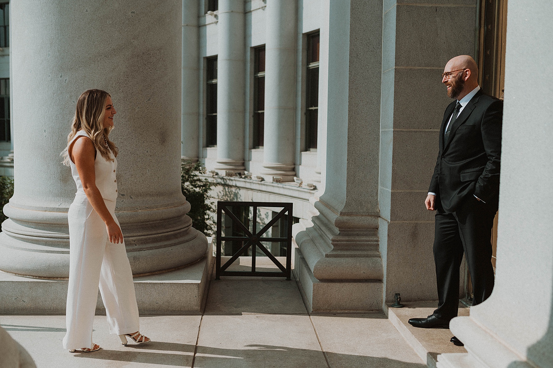 a couple doing denver engagement photos at the courthouse