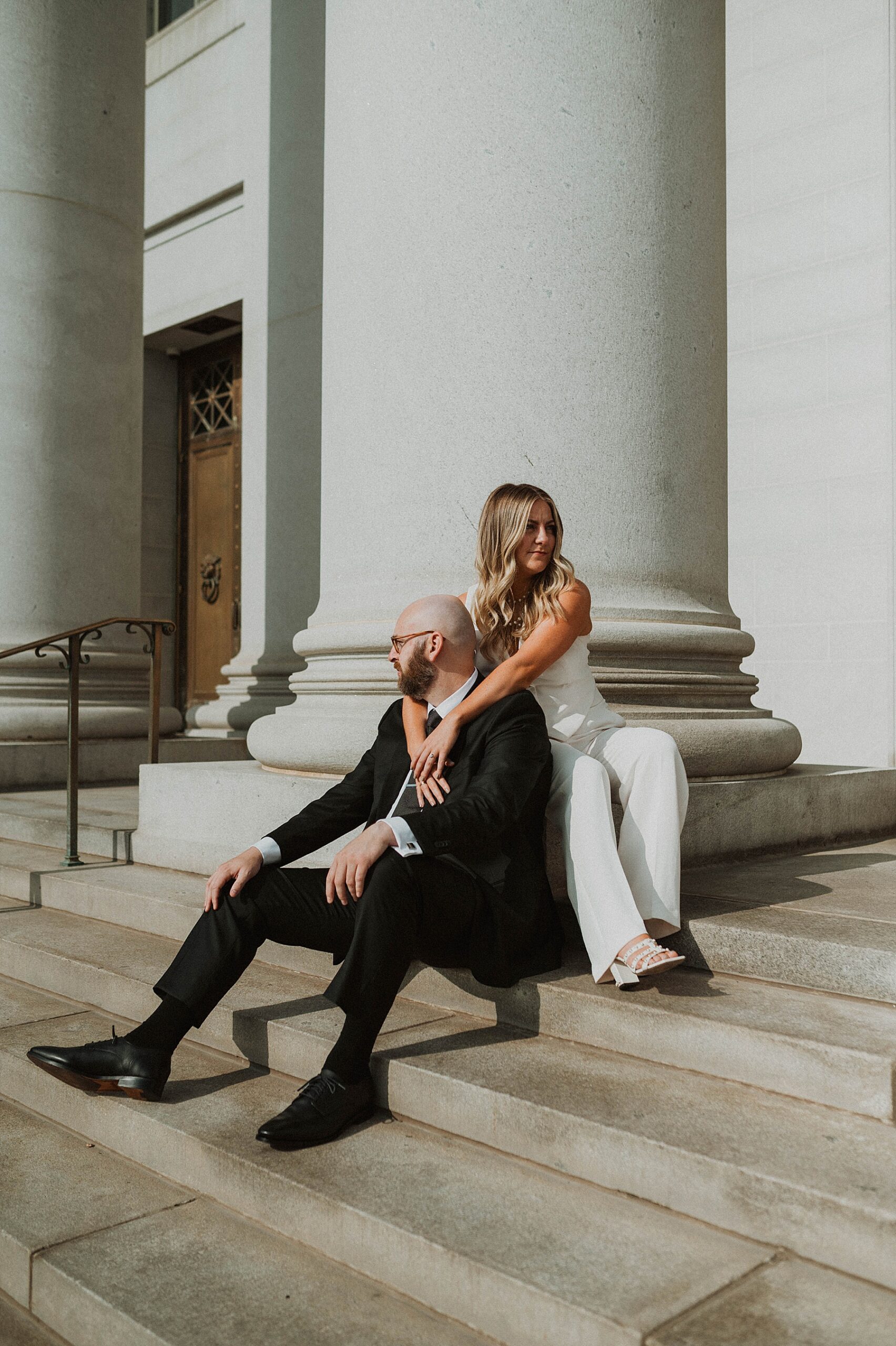 a couple doing denver engagement photos at the courthouse