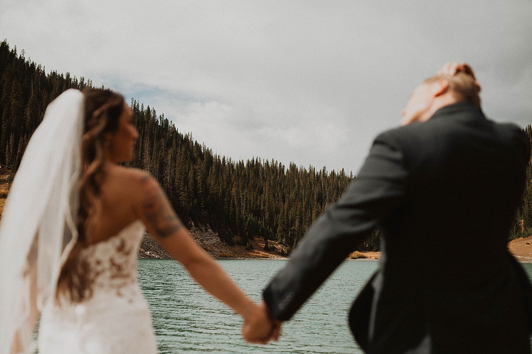 bride and groom first look at emerald lake in crested butte on their wedding day