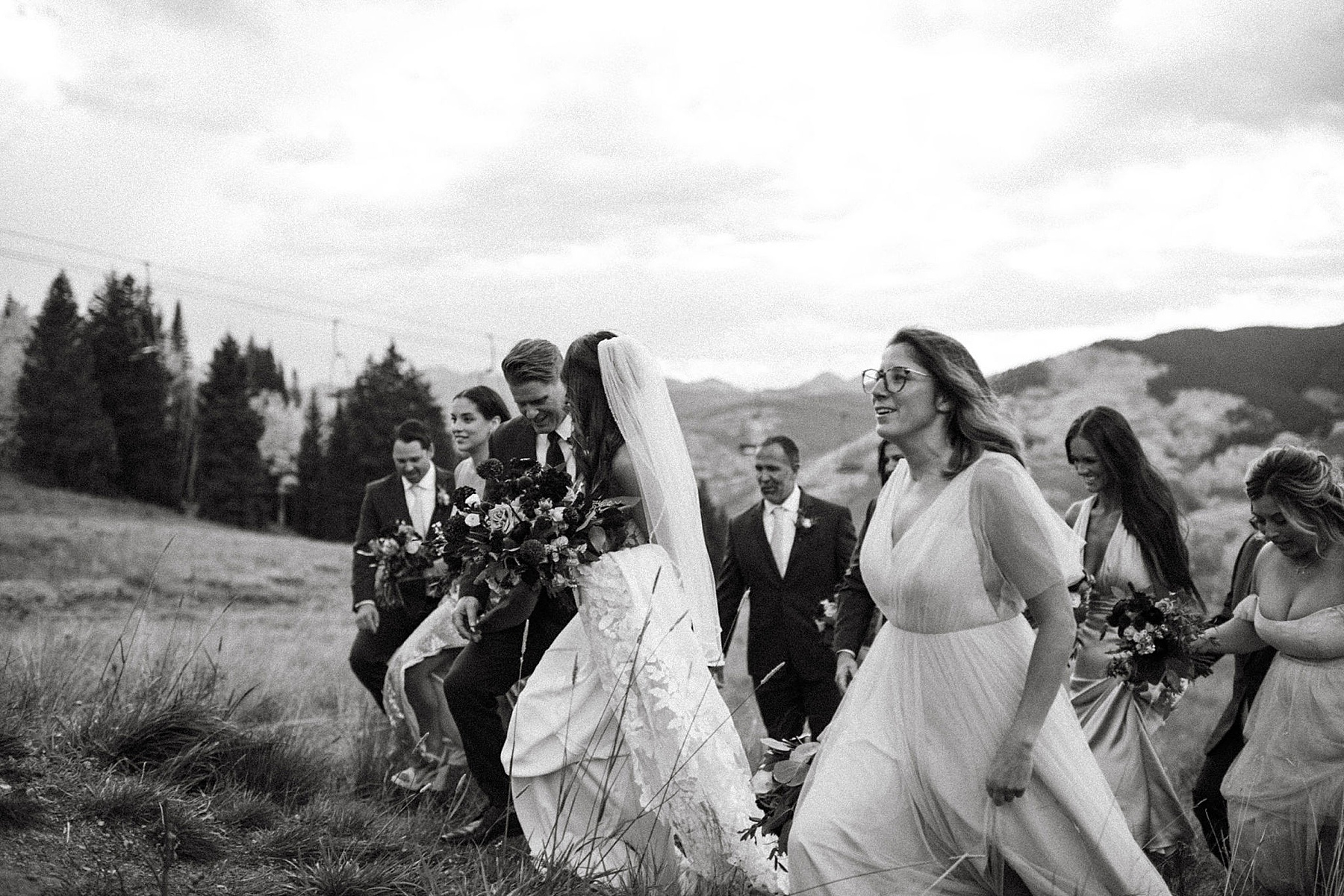 wedding party with bride and groom at ten peaks at crested butte resort in crested butte with bramble and bloom florals