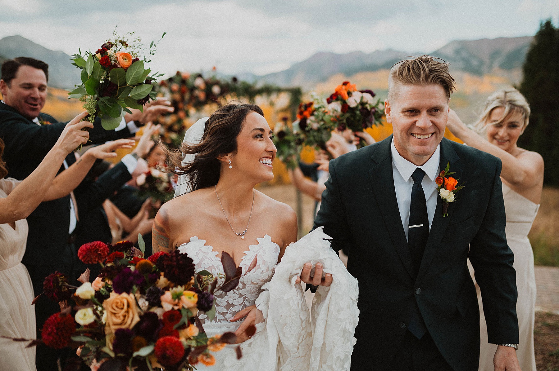 wedding party with bride and groom at ten peaks at crested butte resort in crested butte with bramble and bloom florals