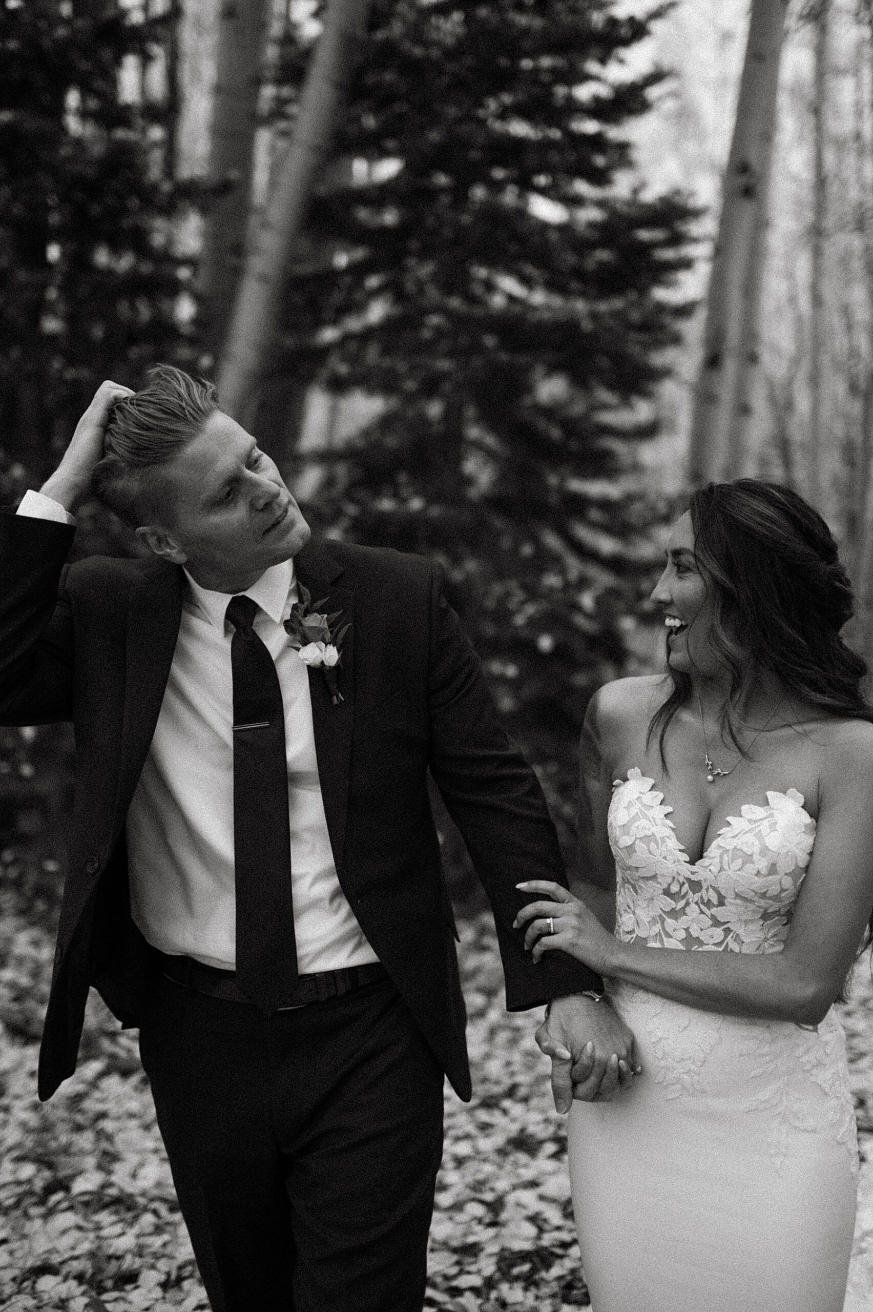 bride and groom in aspens at ten peaks at the crested butte resort for their fall wedding