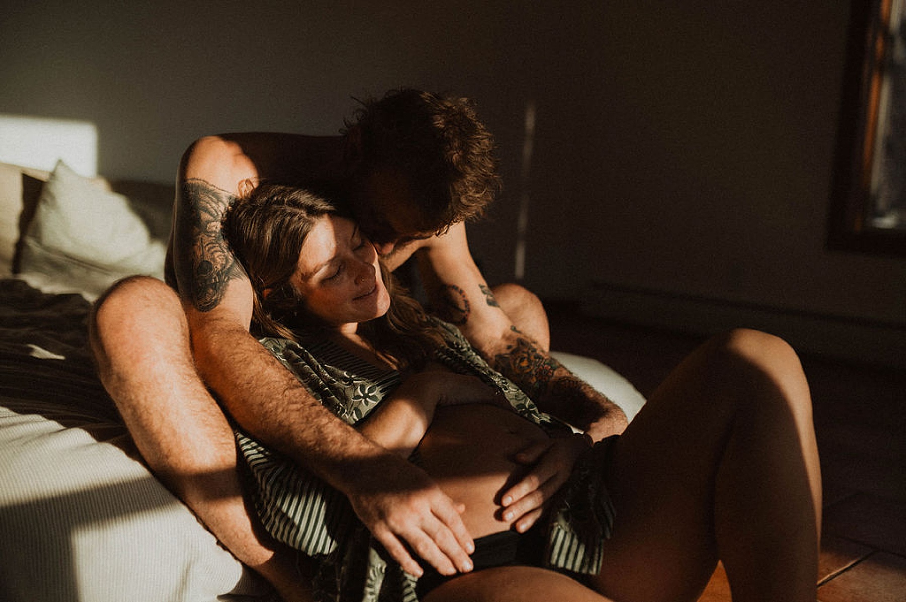 Colorado at-home maternity session. Soon-to-be mother and her partner soaking up the evening sunset. An honest, filmy session. 