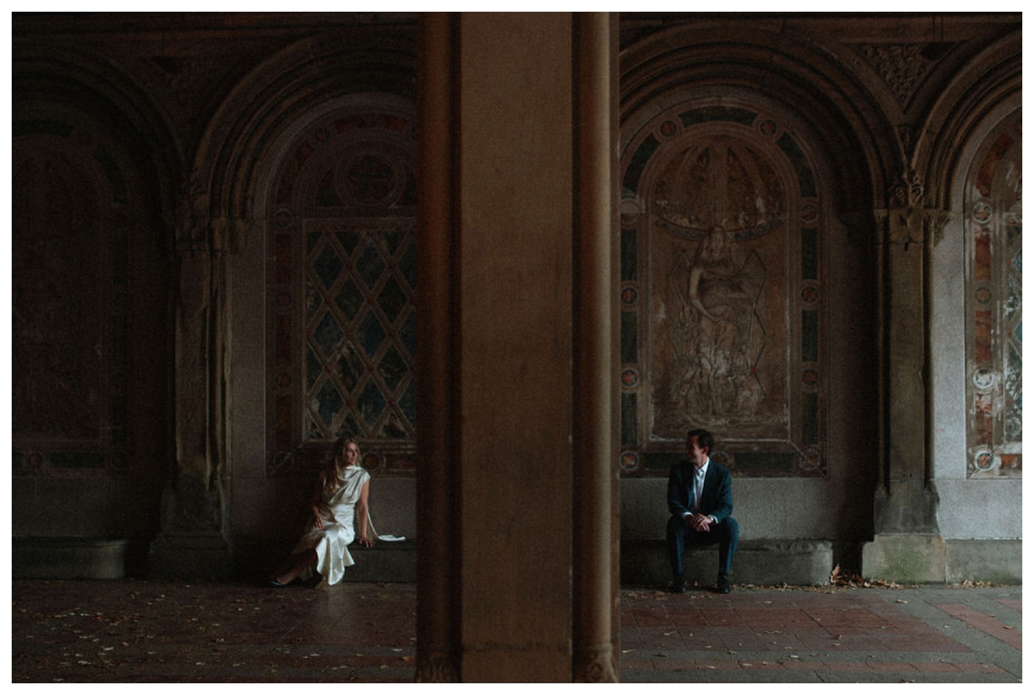 bride and groom at bethesda terrace in central park for an engagement session. NYC wedding photographer.