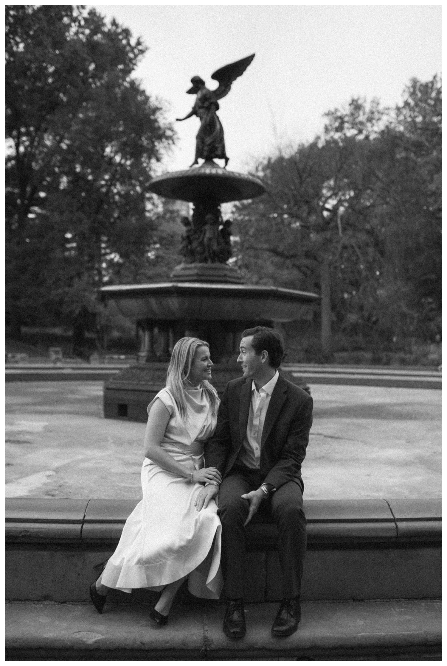 bride and groom at bethesda terrace in central park for an engagement session. NYC wedding photographer.
