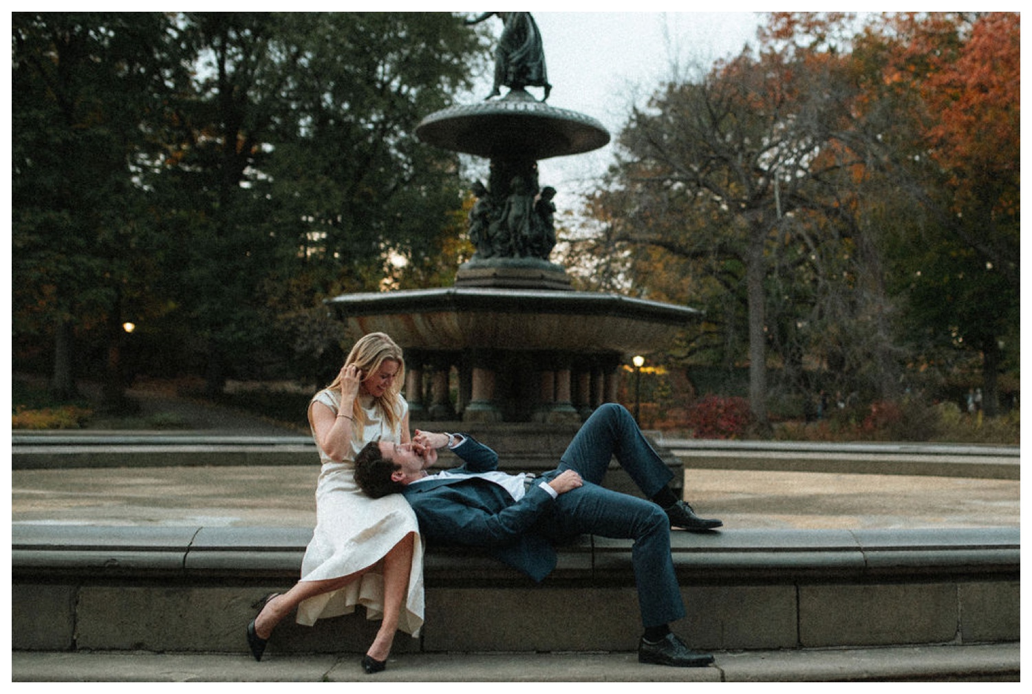 bride and groom at bethesda terrace in central park for an engagement session. NYC wedding photographer.