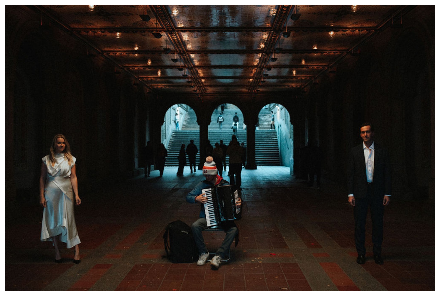 bride and groom at bethesda terrace in central park for an engagement session. NYC wedding photographer.