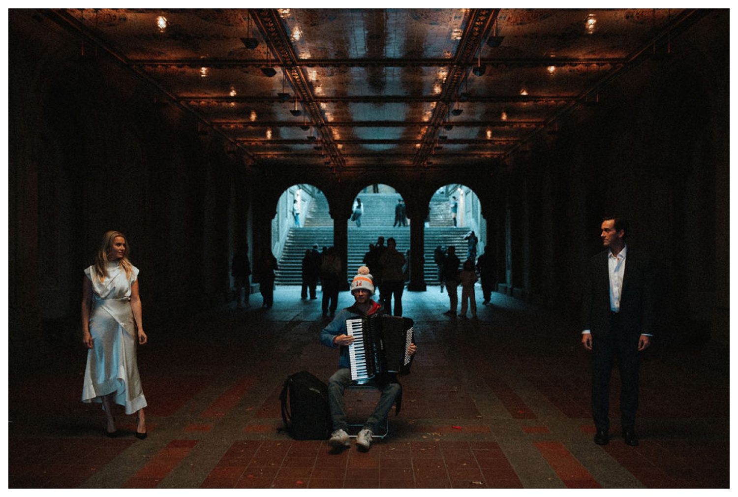 bride and groom at bethesda terrace in central park for an engagement session. NYC wedding photographer.