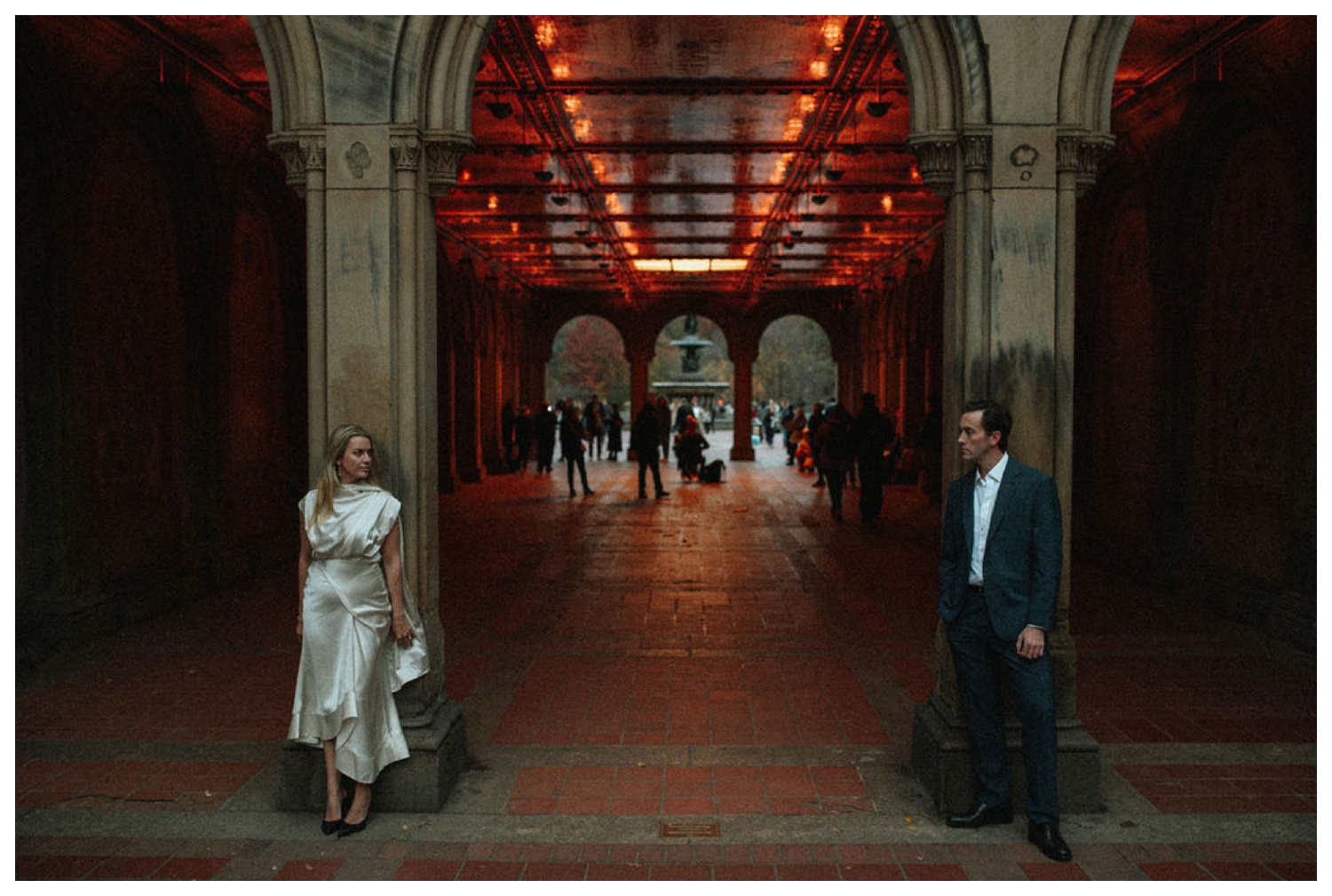 bride and groom at bethesda terrace in central park for an engagement session. NYC wedding photographer.