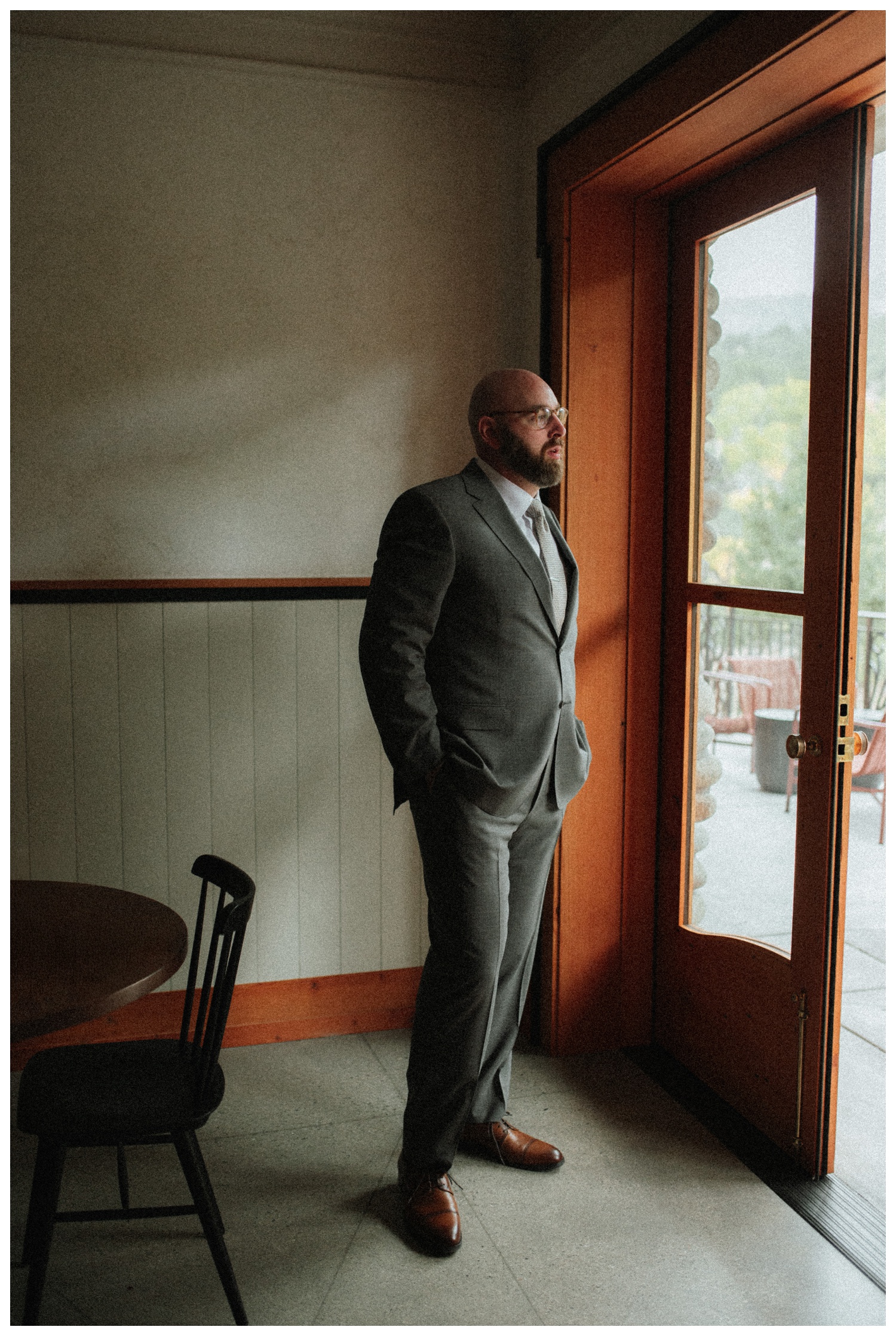 groom getting ready at surf hotel in buena vista, colorado.
