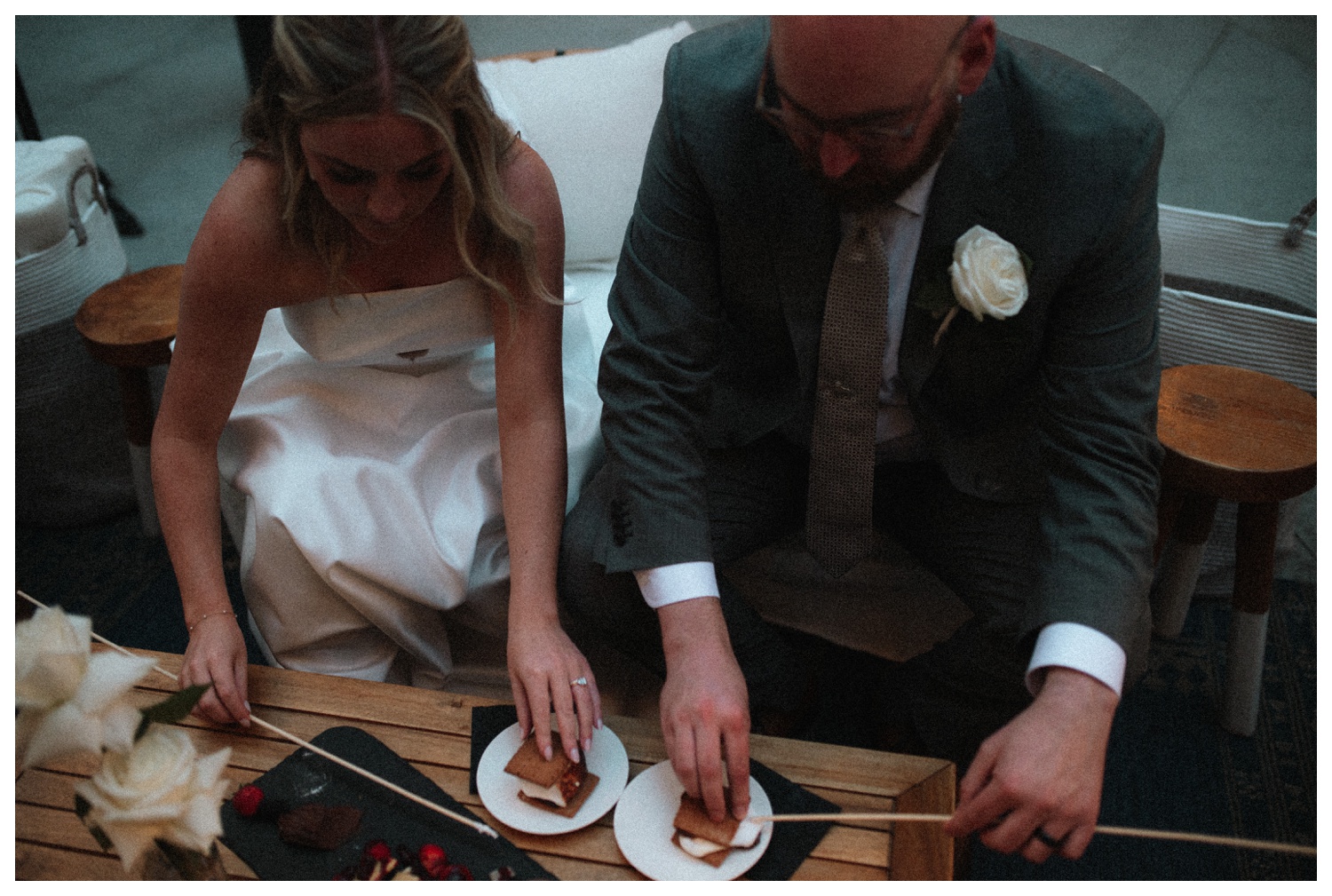 bride and groom having s'mores at the Surf Hotel in Buena Vista. Luxury wedding in the mountains. Colorado wedding photographer. Parr Photo Co. 