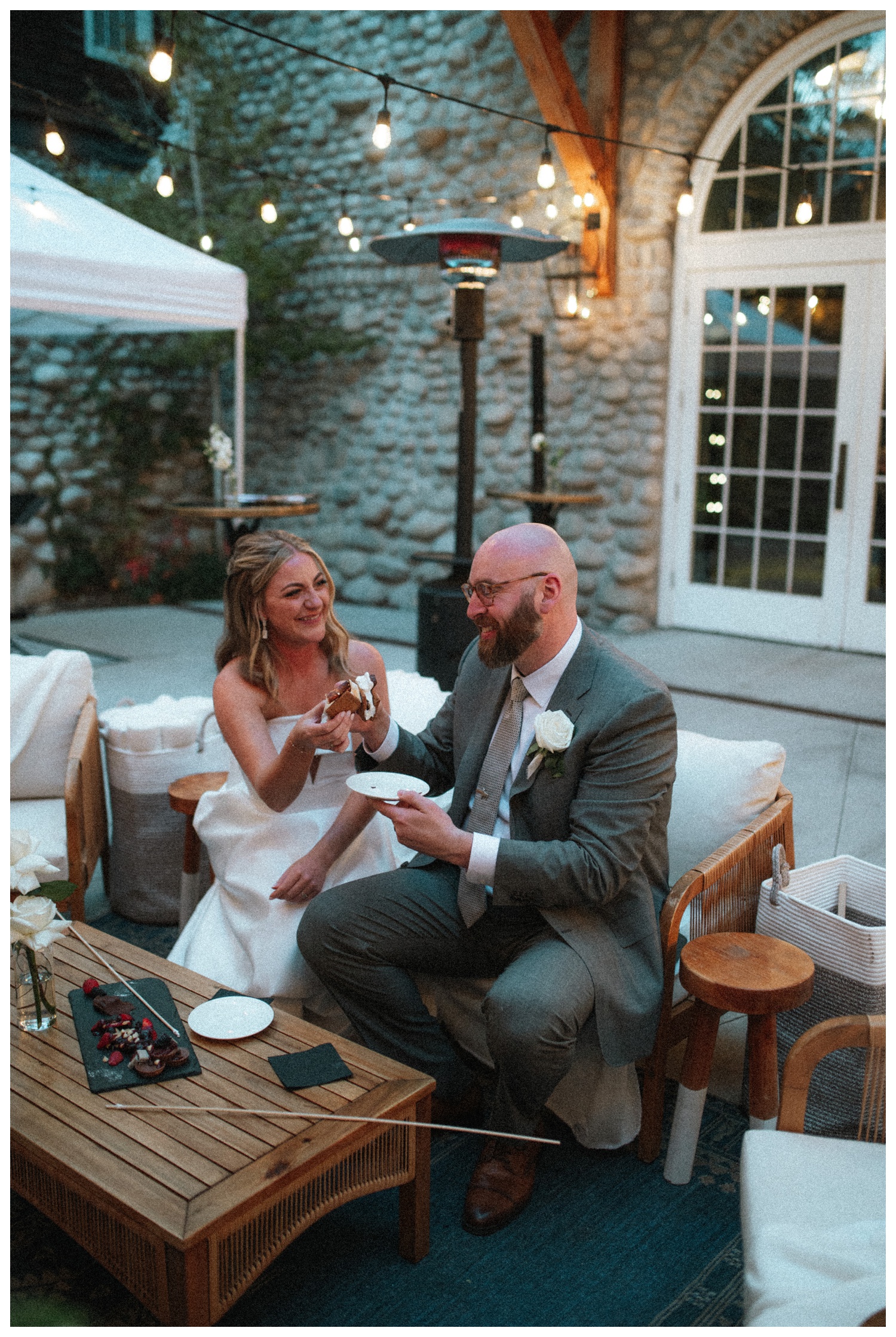 bride and groom having s'mores at the Surf Hotel in Buena Vista. Luxury wedding in the mountains. Colorado wedding photographer. Parr Photo Co. 