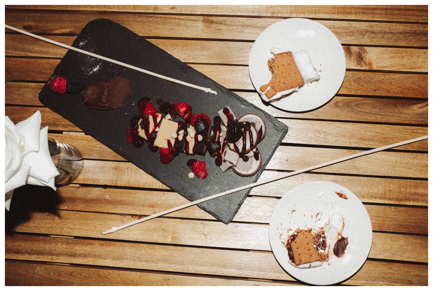 bride and groom having s'mores at the Surf Hotel in Buena Vista. Luxury wedding in the mountains. Colorado wedding photographer. Parr Photo Co. 