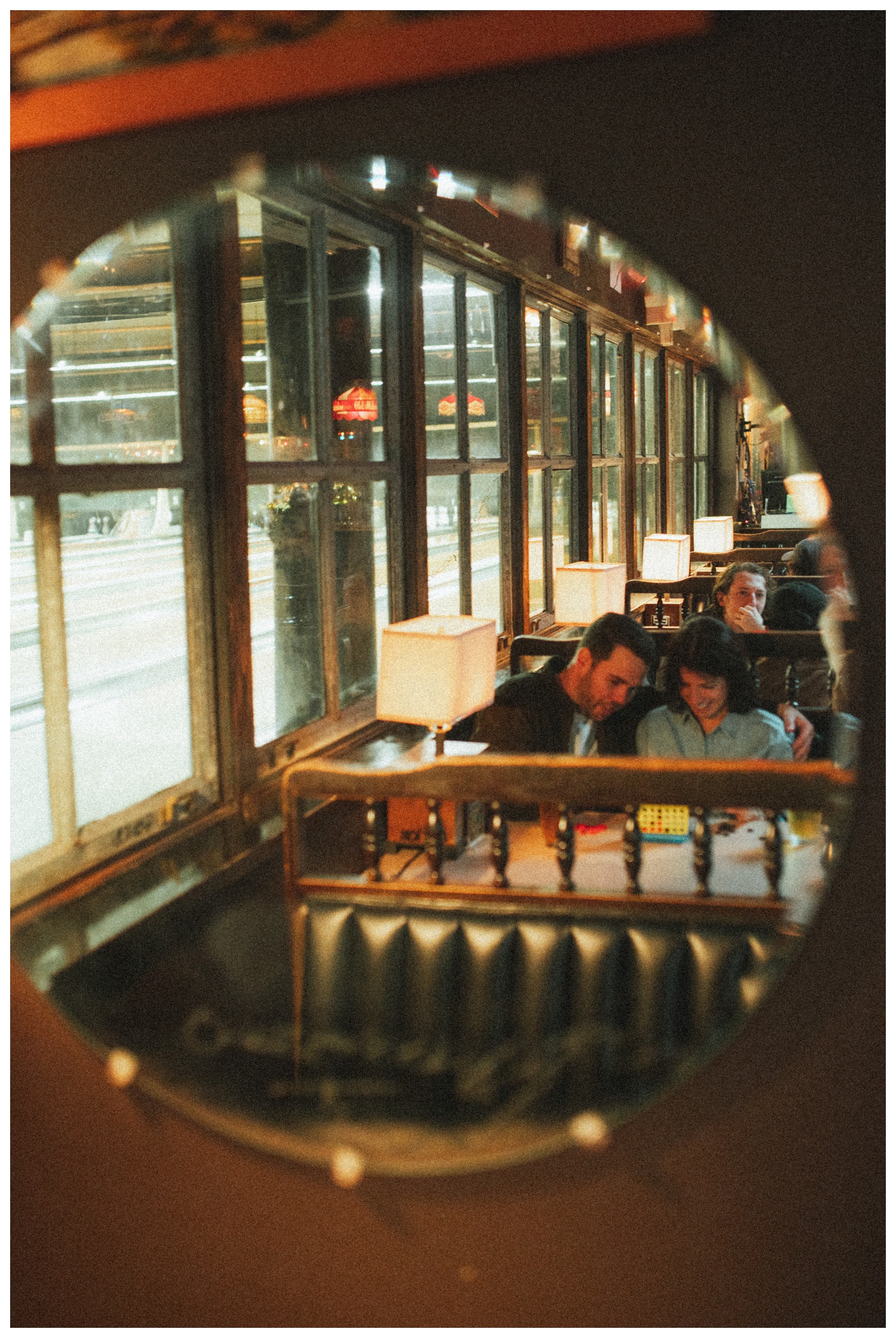 Engaged couple playing Connect Four at THE GUTTER bowling alley for their engagement session in Williamsburg Brooklyn. Brooklyn Wedding Photographer. Parr Photo Co