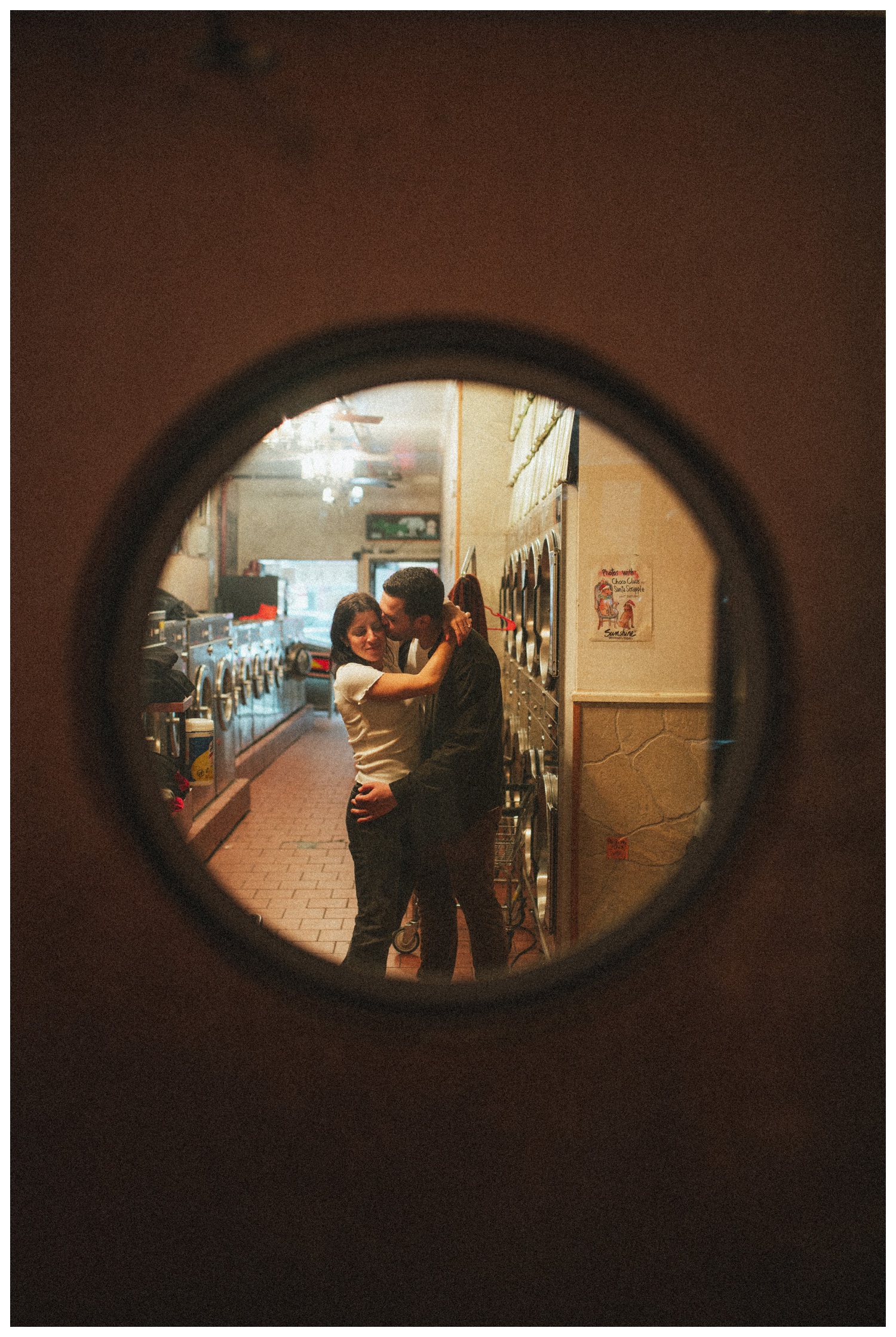 Engaged couple at Sunshine Laundromat Pinball Bar in Greenpoint Brooklyn playing pinball. Brooklyn Wedding Photographer. Parr Photo Co.