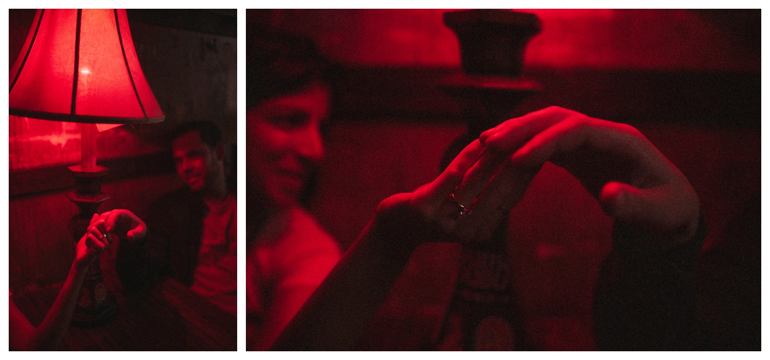 Engaged couple sitting in a bar under red light in Greenpoint Brooklyn. Brooklyn Wedding Photographer. Parr Photo Co