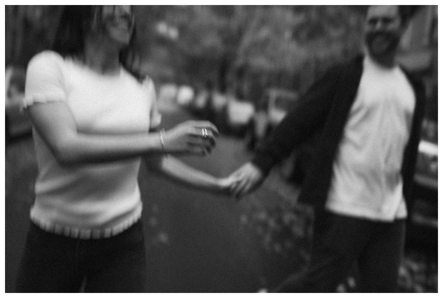 Engaged couple running through the streets of Greenpoint Brooklyn in the rain. Brooklyn Wedding Photographer. Parr Photo Co