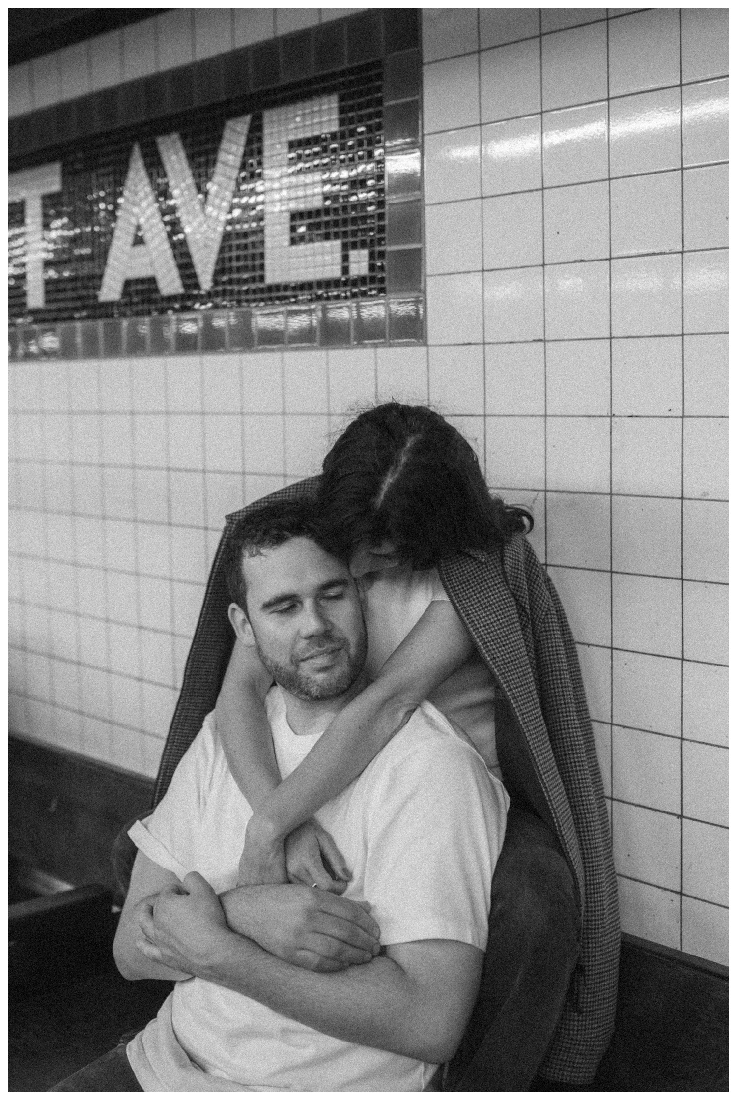 Engaged couple walking down the Greenpoint subway station. Brooklyn Wedding Photographer
