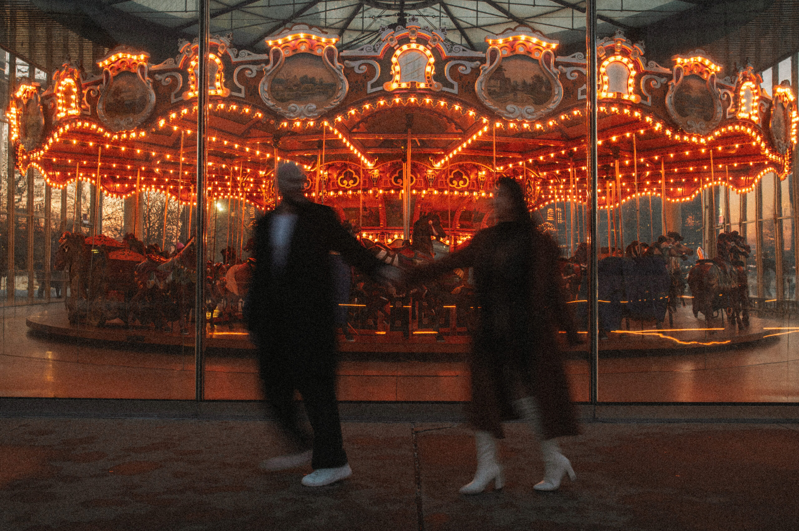 Engagement session in DUMBO at Brooklyn Bridge Park in front of Jane's Carousel. 